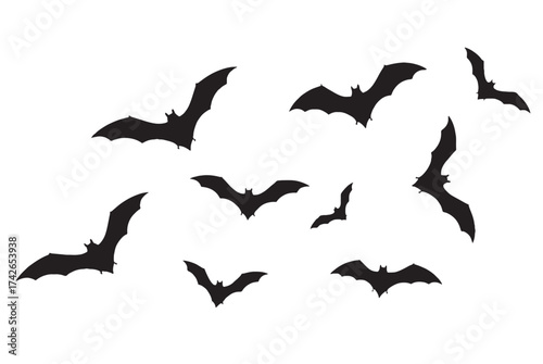 ASilhouette of a flock of bats flying in a white background