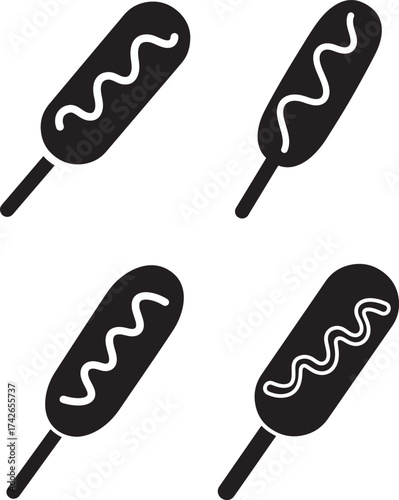 Four corn dog silhouettes with mustard sauce