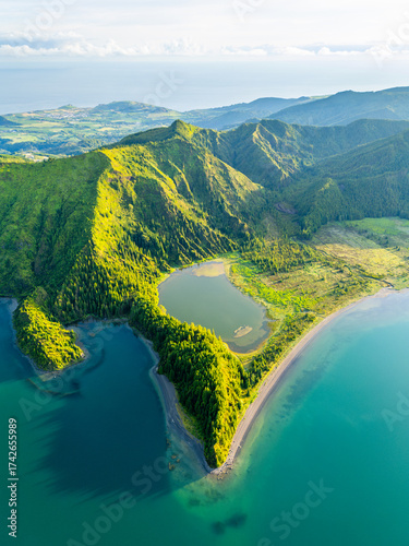 Lagoa do Fogo Lake on Sunny Morning. Green Lush Hills and Mountains. Azores, Sao Miguel Island. Portugal. Aerial Drone Shot