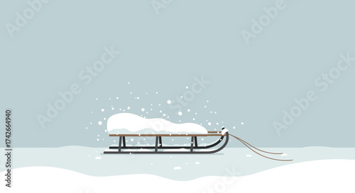 Wooden sled covered in snow sitting on a frozen surface