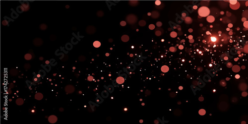 Bright red and pink bokeh lights blur into an abstract heart pattern perfect for a Valentine’s Day design or Christmas card backgrounds