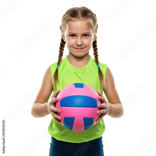 Young girl smiling while holding a pink and blue volleyball