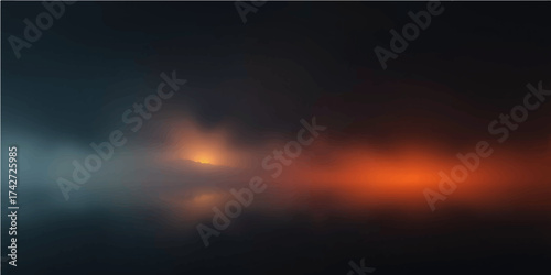 The beautiful orange and red sunset light paints the evening sky with stunning clouds over the nature landscape at dusk