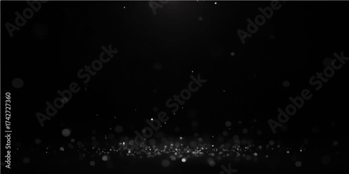 Rain drops on the dark window pane glow like distant stars in the night sky