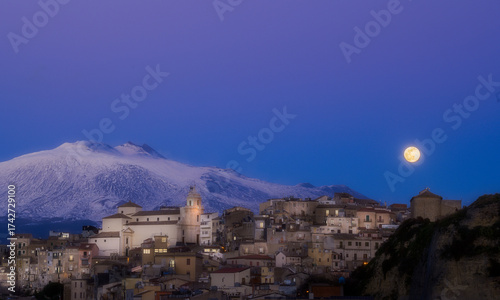 Принти на полотні A small town Centuripe with a church and a vulcano Etna in the background