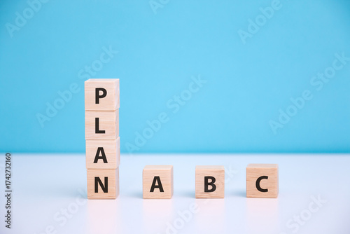 Wooden cube with PLAN A, B, C word. The concept of planning in business.