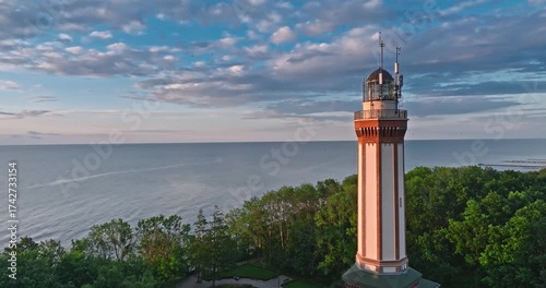 Stunning lighthouse at sunset in Rewal at Baltic Sea.