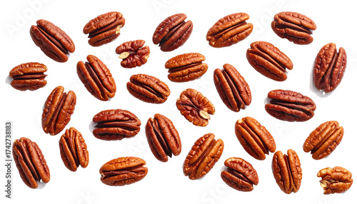 Pecan nut halves falling scattered on transparent background