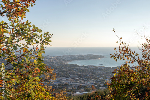 A view from a mountainside on an autumn day. A view from the observation deck of the sea and the city of Gelendzhik. Autumn in the mountains by the Black Sea.