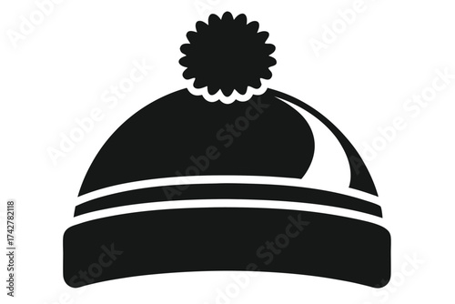 Isolated black winter cap showcases a ribbed design with a fuzzy pompom attached