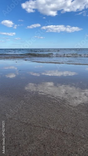 Wallpaper Mural Sea waves washing sandy shore under bright sunlight with clear blue sky and gentle surf Torontodigital.ca