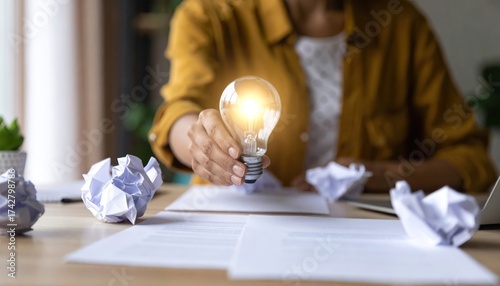 Woman holding light bulb with creative idea and innovation concept.