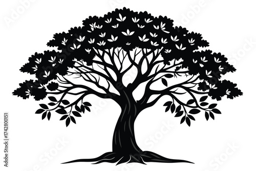 Striking silhouette of a mature tree with leaves and roots is clearly displayed
