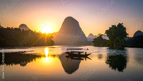 Serene sunrise over a calm river, framed by mountains and foliage