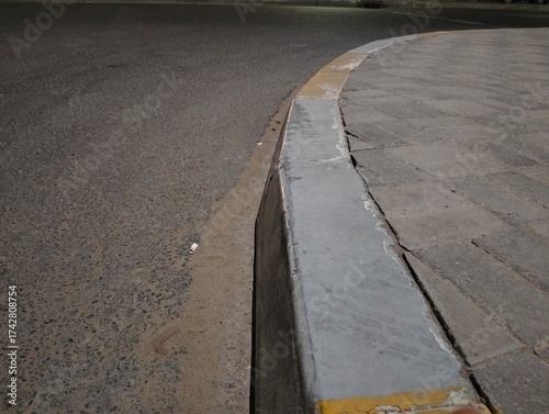 Fotografija Kerb stone  recessed and elevated types fixed on the side of the road for transp