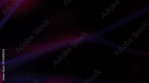 A stunning plasma globe radiates vibrant blue and pink electric arcs from its core, creating a mesmerizing and colorful display of static energy in the dark.
