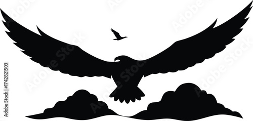 Eagle soars above the clouds a powerful silhouette perfect for logos and symbolic designs