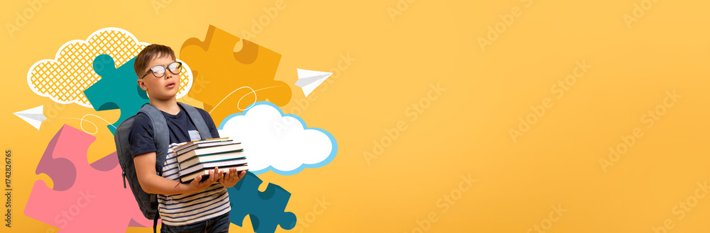 © Prostock-studio - A young child with glasses smiles while holding a stack of books in a bright, cheerful setting. Colorful puzzle pieces and clouds form a vibrant background, enhancing the school atmosphere.