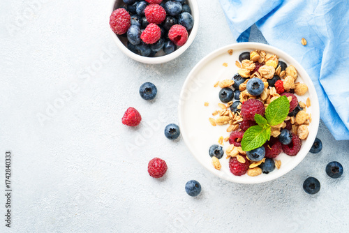 Wallpaper Mural Yogurt with fresh berries and granola on white table. Torontodigital.ca