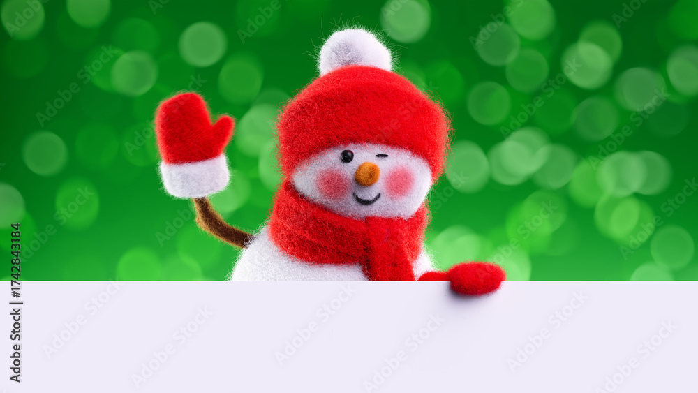 Fototapeta premium Waving wool‑felt snowman in red hat and scarf behind a clean white banner on green bokeh. Friendly seasonal header layout. 3d render illustration.