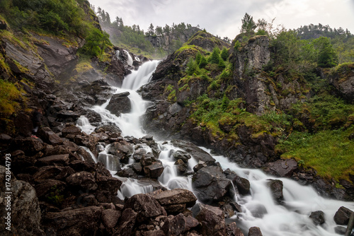 låtefossen Lattefossen waterfall in norway during rainday cold waterflow river long exposure