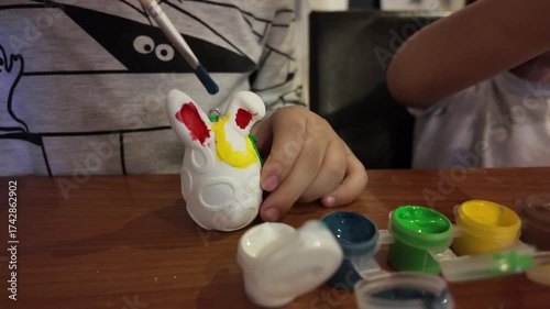Kids painting easter eggs. Learning to Draw. High quality 4k footage