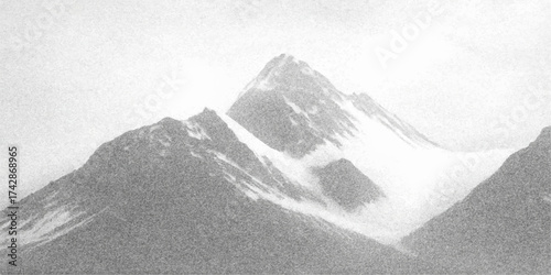 Black and white panorama of a high snowy mountain range with cold winter landscape