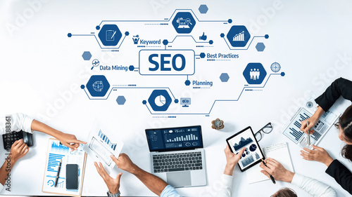 Quadro su tela This image showcases a collaborative workspace where professionals engage in strategic SEO planning and data mining, utilizing modern tools for enhanced online visibility