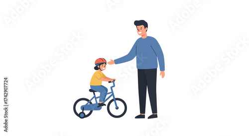 Father teaching daughter to ride a bicycle wearing helmet.