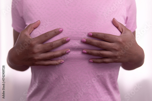 Wallpaper Mural Woman performing breast self examination for cancer prevention and health awareness Torontodigital.ca