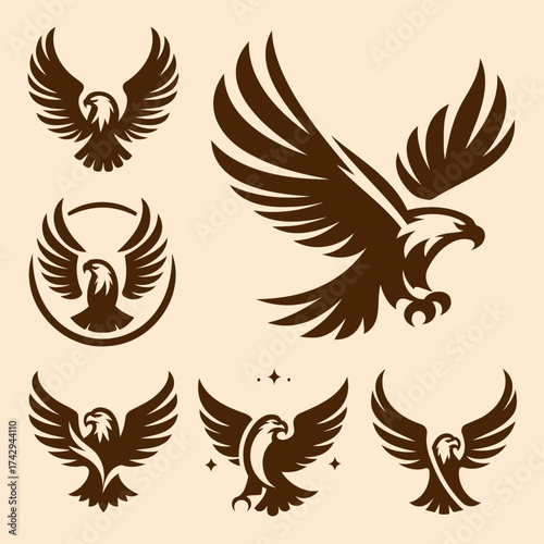 Silhouette logos of eagles in various poses