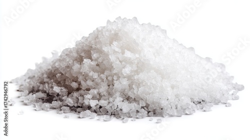 salt crystals in two forms: a pile of coarse salt and a container filled with finely ground salt