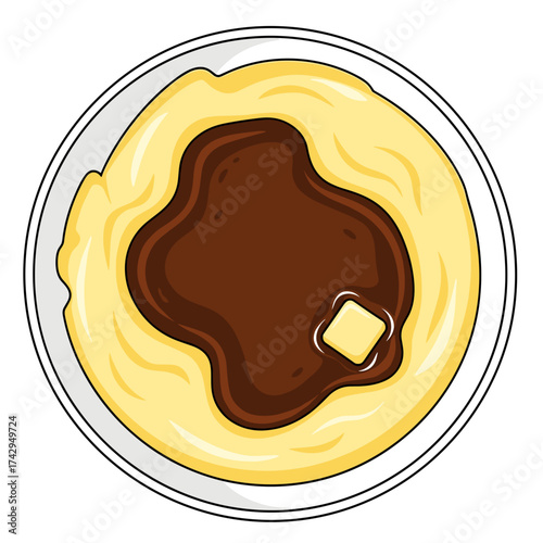 Delicious mashed potatoes with gravy and a small butter square on top.