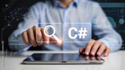 Professional developer analyzing code with digital interface and tablet in modern workspace, focusing on C# programming for software development success