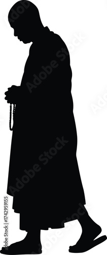 Silhouette of a buddhist monk walking peacefully holding prayer beads in meditation and spiritual contemplation vector