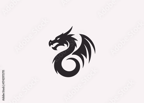 A simple silhouette logo of a dragon, representing strength, mystery, and timeless legend