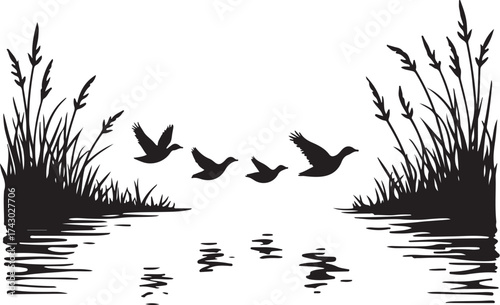 Black silhouette flock of ducks flying over water and reeds