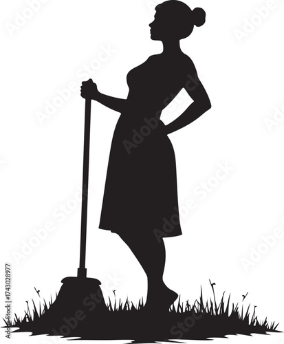 Black silhouette of a woman with a broom standing in grass