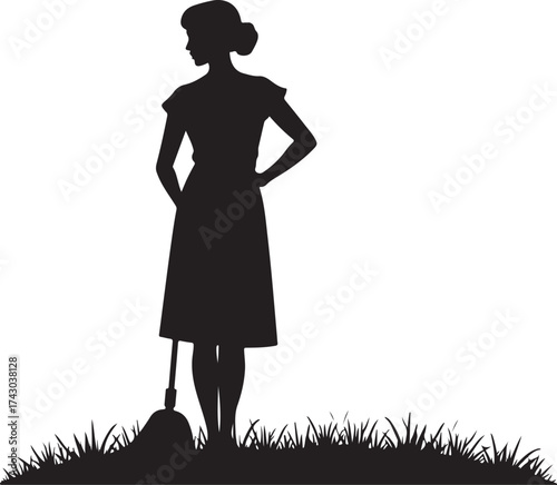 Silhouette of a woman with a mop standing in grass