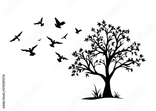 tree silhouette with birds flying
