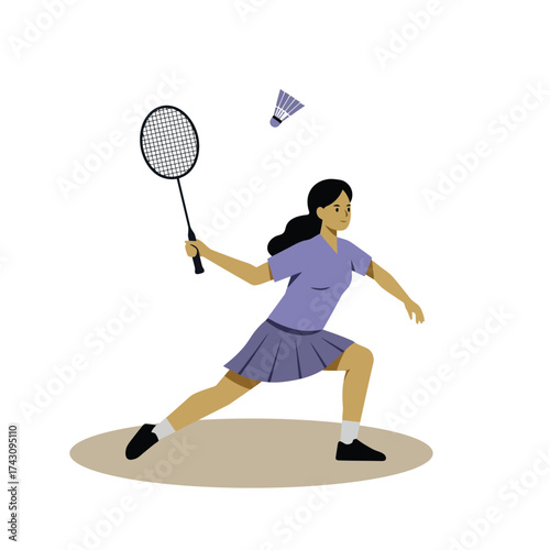Female badminton player in action hitting shuttlecock with racket.