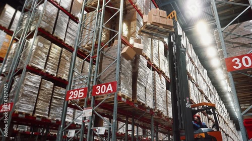 A working day at a large distribution warehouse. An accident occurs during loading: several boxes fall from a forklift from a great height. Concept of e-commerce industry and logistics