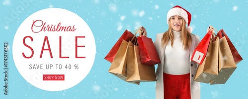 Young woman in Santa hat an...