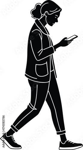 Woman walking and looking at her phone silhouette