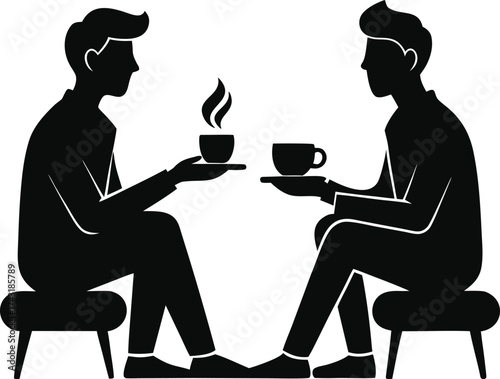 Two men sitting and drinking coffee silhouette