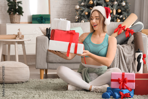 Sporty young woman in Santa...
