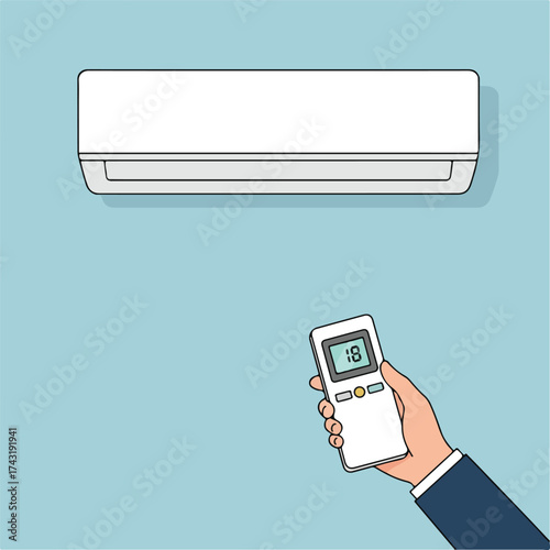 Hand holding remote control for air conditioner