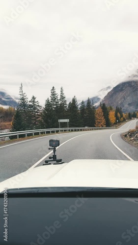 This journey takes you through the stunning autumn scenery of Altai mountains along the Kurai road. Majestic peaks rise in tbackground, while vibrant colors of fall foliage create a picturesque view