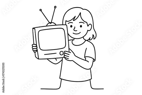 Child happily holds a vintage television set while smiling at the viewer in a cozy indoor setting