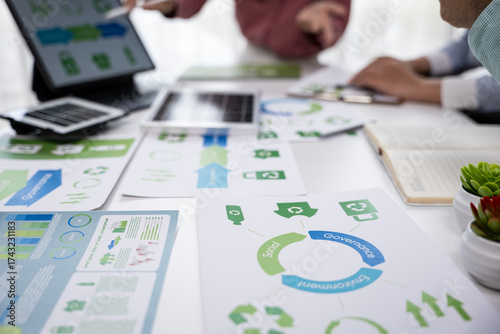 Analyzing business strategies office workspace presentation materials modern environment close-up viewpoint sustainability concept